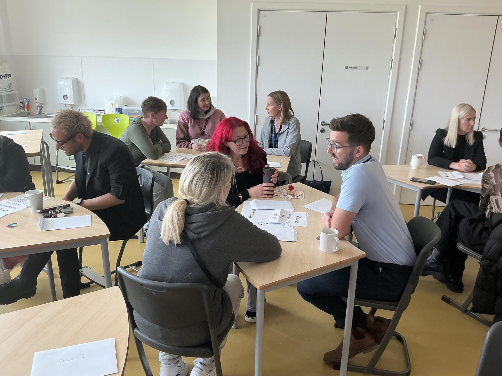 People talking to each other in a room.